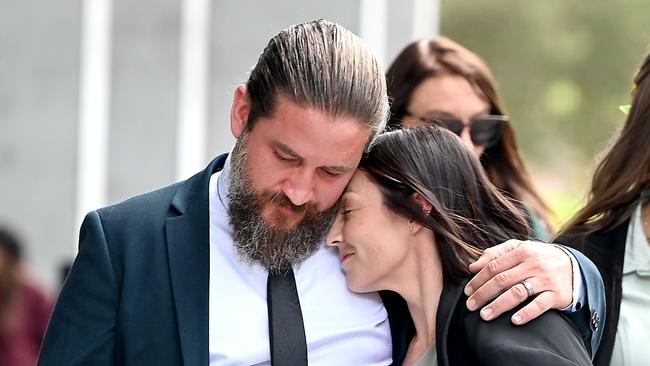 Kelly's sister Danielle Carroll with husband Reece outside the court following Johnston’s sentence. Ms Carroll said the former marine had inflicted a lifetime of suffering on the family with his actions. Picture: NCA NewsWire / John Gass