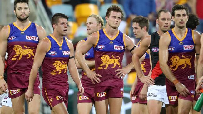 Dejected Lions players after the final siren. Picture: Darren England