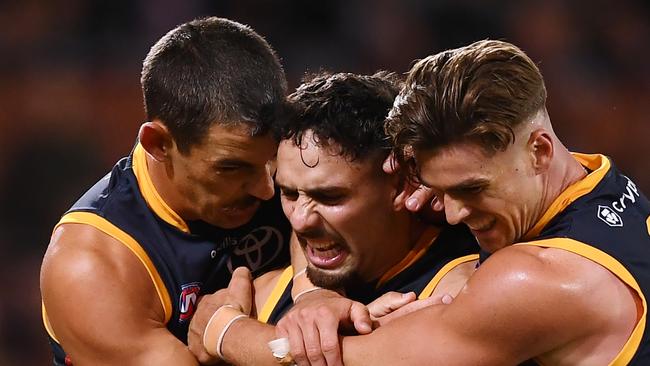 ADELAIDE, AUSTRALIA - APRIL 01: Izak Rankine of the Crows celebrates a goal with Taylor Walker of the Crows and Ben Keays of the Crows during the round three AFL match between Port Adelaide Power and Adelaide Crows at Adelaide Oval, on April 01, 2023, in Adelaide, Australia. (Photo by Mark Brake/Getty Images) *** BESTPIX ***