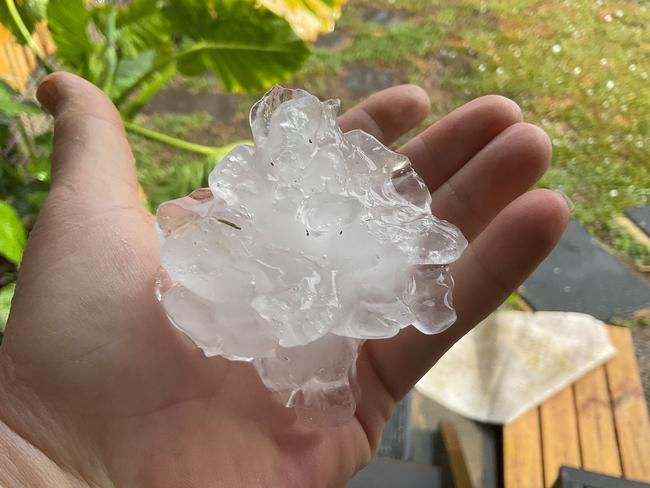 The hailstone that fell at North Mackay on Wednesday during the storm was almost bigger than Mark Stanwell’s hand. Picture: Mark Stanwell.
