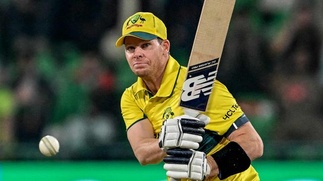 Australia's captain Steve Smith watches the ball after playing a shot during the ICC Champions Trophy one-day international cricket match against Afghanistan at the Gaddafi Stadium in Lahore last week. Picture: Aamir Qureshi / AFP