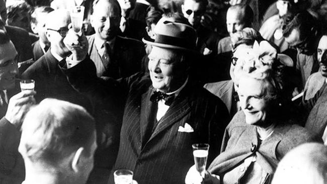 Sir Winston Churchill and his wife Clementine toast with champagne in Switzerland 1946.