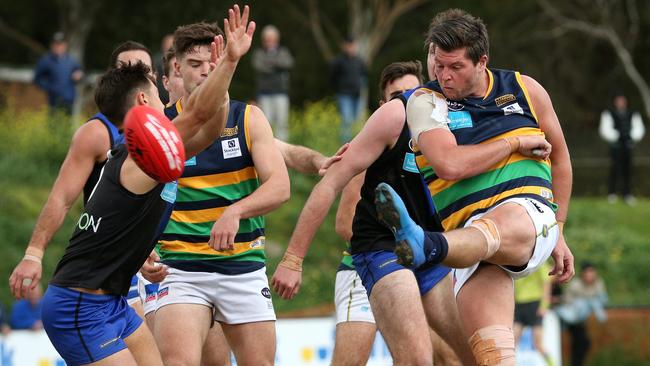 Anthony Lynch of St Kevin's snaps a goal during VAFA Premier Grand Final against University Blues in 2019. Picture: Hamish Blair