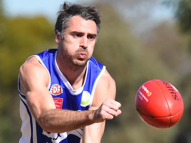 Coburg Districts’ Kyle Dalmau fires off a handball. Picture: Josie Hayden