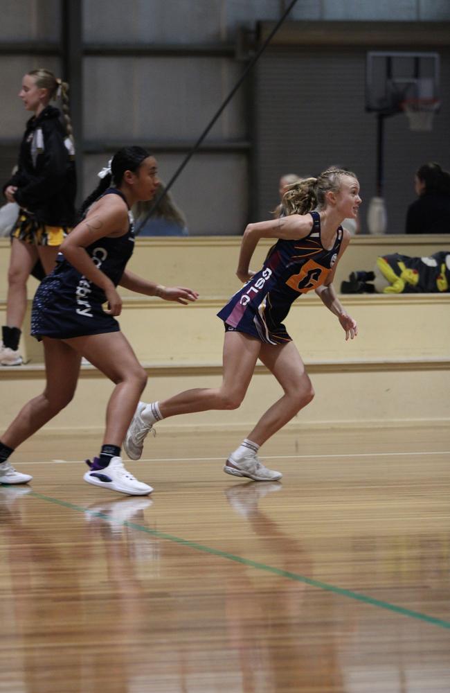 Netball action at QISSN 2024. Canterbury College v Good Shepherd Lutheran College