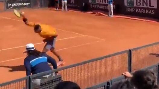 Nic Kyrgios smashes his racquet