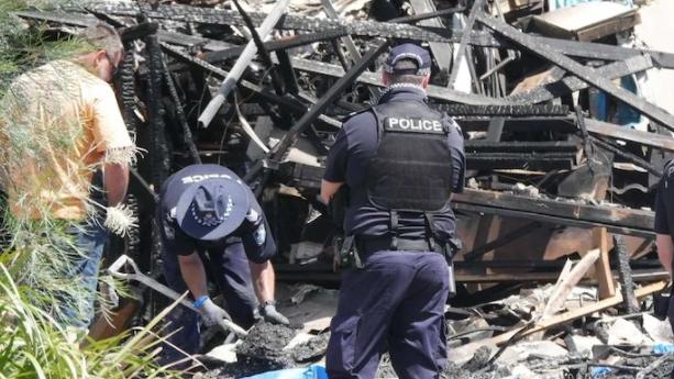 Police at the scene where Doreen Langham and Gary Hely died in February.