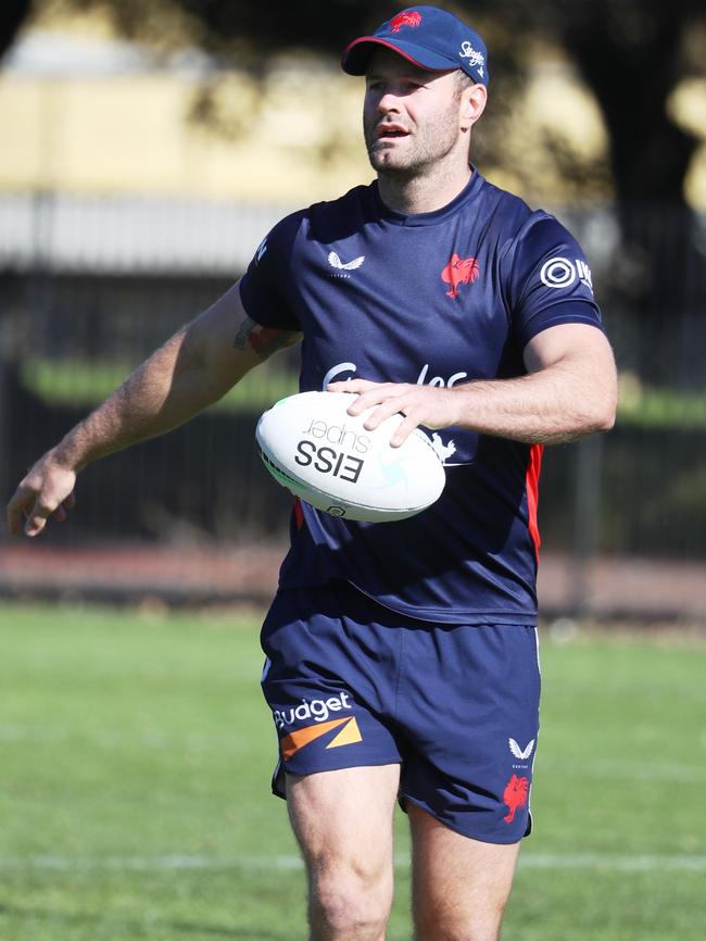 Roosters football players exercise on Kippax Lake at Moore Park. Blue cap is Boyd Cordner . .picture John Grainger