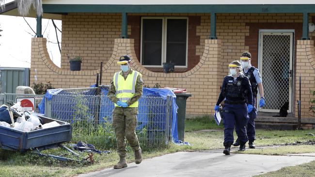 Wilcannia police officers and an ADF member check Covid compliance. Picture: Chris Pavlich