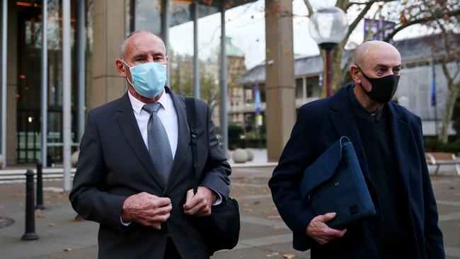 Chris Dawson, left, leaves the Federal Court in Sydney on Thursday. Picture: Nikki Short