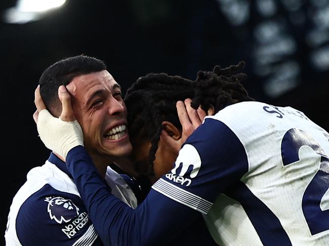 Djed Spence (right) celebrates scoring Totternham's third goal. Picture: AFP