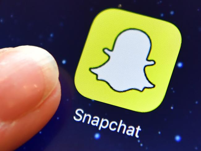 LONDON, ENGLAND - AUGUST 03: A finger is posed next to the Snapchat app logo on an iPad on August 3, 2016 in London, England.  (Photo by Carl Court/Getty Images)