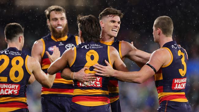 ADELAIDE, AUSTRALIA - JUNE 06: Ben Keays of the Crows hugs Josh Rachele of the Crows after he kicked a goal during the 2025 AFL Round 13 match between the Adelaide Crows and the Brisbane Lions at Adelaide Oval on June 6, 2025 in Adelaide, Australia. (Photo by Sarah Reed/AFL Photos via Getty Images)