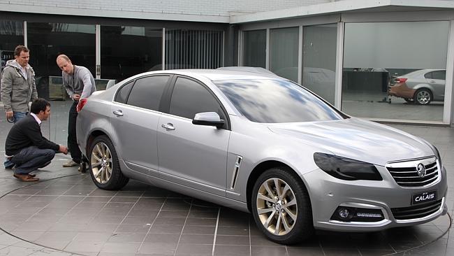 Win for workers ... Holden designers work on a foil-covered clay model of the 2013 Holden VF Calais.