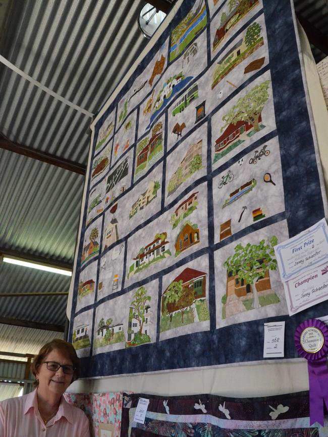 Lyn Prichard with the champion quilt which was made by Jenny Schaefer at the Charters Towers Show. Picture: Trudy Brown