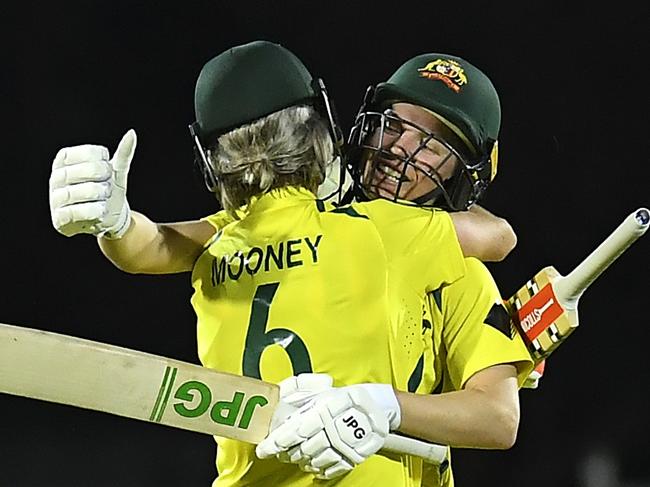 MACKAY, AUSTRALIA - SEPTEMBER 24: Beth Mooney and Nicola Carey of Australia celebrate victory during game two of the Women's One Day International series between Australia and India at Great Barrier Reef Arena on September 24, 2021 in Mackay, Australia. (Photo by Albert Perez/Getty Images)