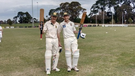 Glen and Jordan Furhmann raise their bats after putting on 369 unbroken for Mt Eliza’s fourths on Saturday. Picture: Supplied