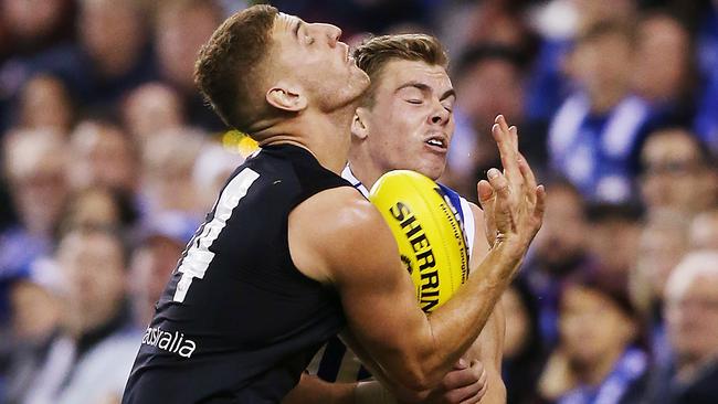 MELBOURNE, AUSTRALIA - MAY 05: Cameron Zurhaar of the Kangaroos collides into Liam Jones of the Blues (L) during the round seven AFL match between the Carlton Blues and the North Melbourne Kangaroos at Marvel Stadium on May 05, 2019 in Melbourne, Australia. (Photo by Michael Dodge/Getty Images)