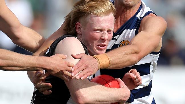 Wangaratta’s Hunter Gottschling tries to break a tackle during last year’s grand final. Picture Yuri Kouzmin