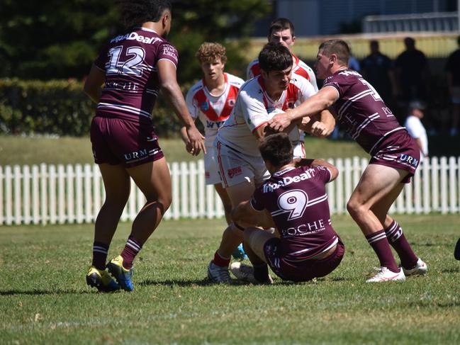 Corey Ackers runs over Jake Fulton. Picture: Sean Teuma/NewsLocal.