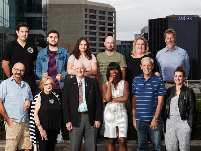 Nick Watson, Alex Gentilcore, Gail Brennan, Marty Wilson, Erica Pennington, Joe Keynes, Phil O'Leary, Lyn Bacon, Peter Allen, Khadija Gbla, Rex Hutton and Ilinca Bocse pose for a picture on the rooftop of Keith Murdoch House in Adelaide, where the group of 12 citizen's comment on the state election coverage, Thursday, Feb. 15, 2018. (AAP Image/MATT LOXTON)