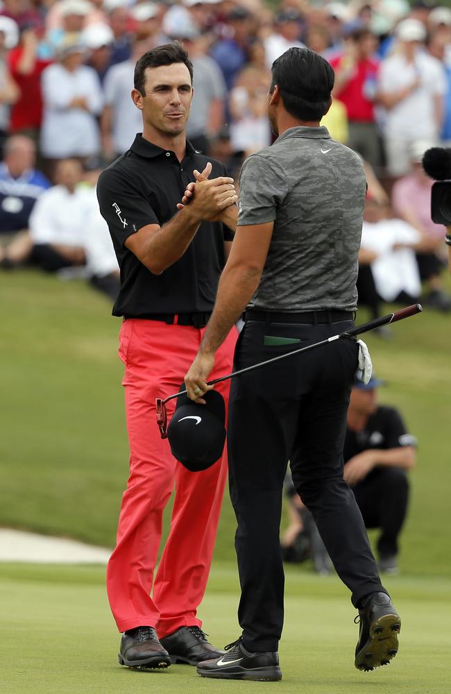 Billy Horschel, left, and Jason Day, right, shake hands after their playoff.