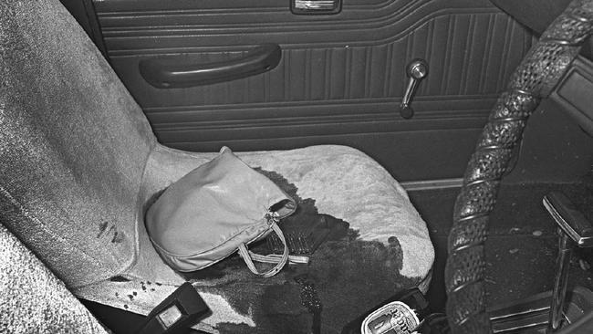 A police photograph of the interior of the Valiant sedan that Gwen Grover was found dead in on Lake St in Cairns North on October 14, 1983. Note that there is no blood on the handbag. Picture: Supplied