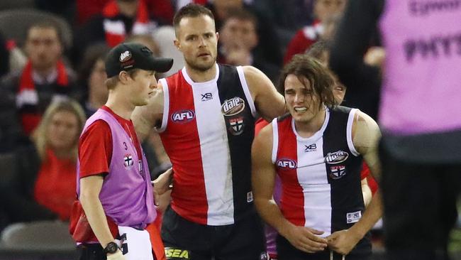 Nathan Brown is helped from the field on Saturday night. Picture: Getty Images