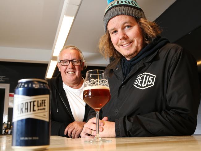 LtoR: Michael Cameron 60 of Adelaide (CEO/Co-founder, Pirate Life Brewing) and his son Jack Cameron 25 of Adelaide (Co-founder/Brewer, Pirate Life Brewing) with a pale ale at Pirate Life Brewing in Hindmarsh. New research shows Hindmarsh, Thebarton and Bowden in Adelaide's 10 hippest suburbs. 05/07/16 Picture: Stephen Laffer