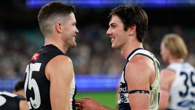 MELBOURNE, AUSTRALIA - MARCH 17: Oliver Henry of the Cats is seen with Jack Crisp of the Magpies during the 2023 AFL Round 01 match between the Geelong Cats and the Collingwood Magpies at the Melbourne Cricket Ground on March 17, 2023 in Melbourne, Australia. (Photo by Dylan Burns/AFL Photos via Getty Images)