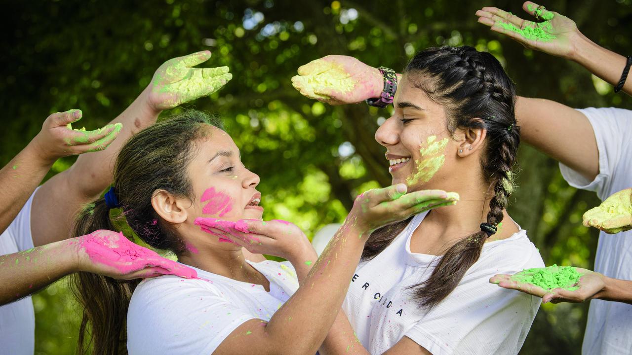 Khushi Umaria (left) and Jahnvi Passi are ready for Holi Colourfest at UniSQ, Thursday, March 13, 2025. Picture: Kevin Farmer