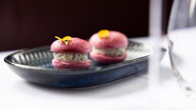 An amuse bouche of goat’s cheese Boursin and beetroot macaron. Photograph David Kelly