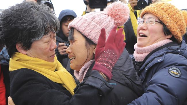 Relatives watch the salvage operation. Picture: Lee Jin-wook/Yonhap via AP