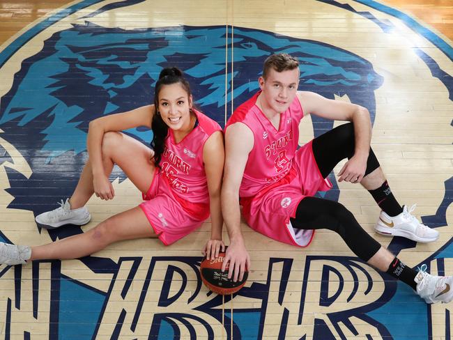 Sturt Sabres are raising money and awareness for breast cancer. Soriah Moon,24, and Thomas Goodall,21, wearing the pink uniforms, 9 June 2018. (AAP Image/Dean Martin)