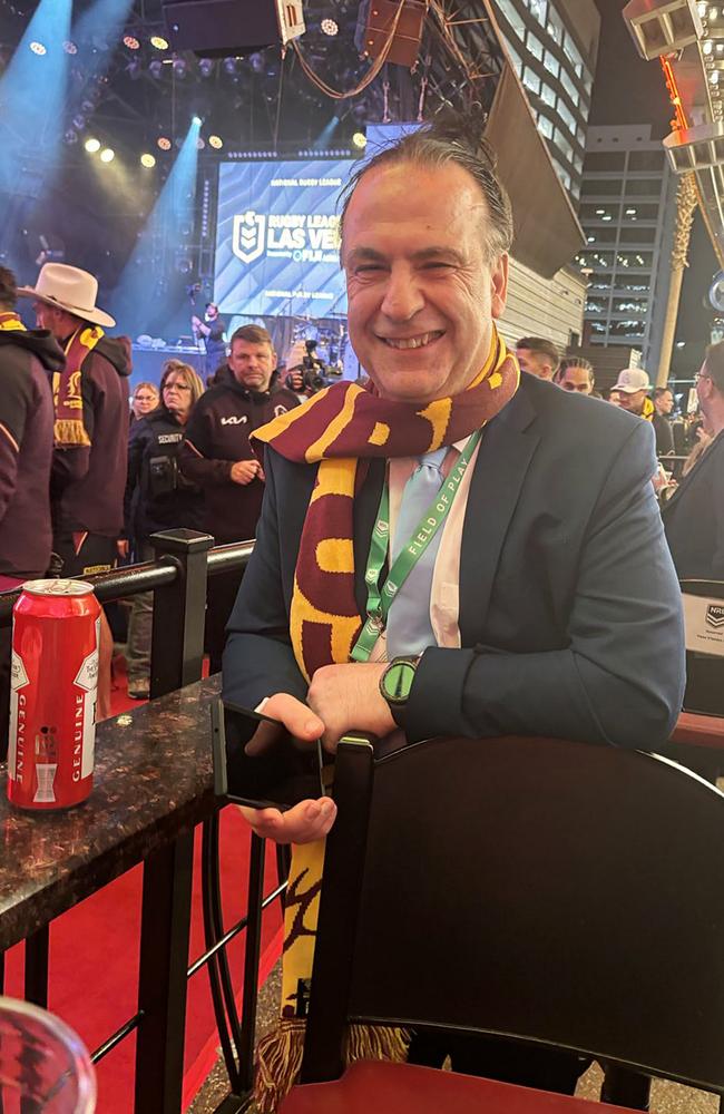 Reece Walsh presents a Brisbane Broncos scarf to Peter V’landys at NRL Fan Fest in Las Vegas. Photo: Pete Badel.