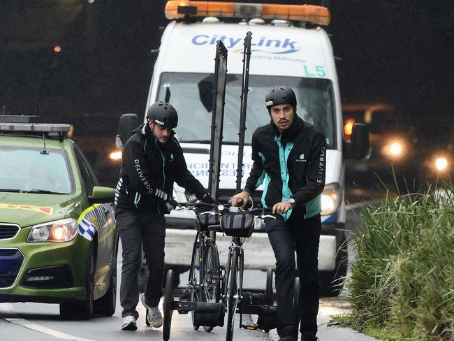 The riders promoting Deliveroo are busted in the Burnley Tunnel. Picture: Nicole Garmston