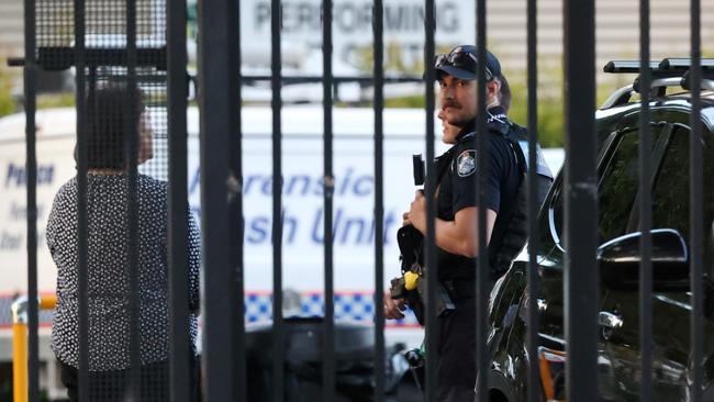 Police at the scene of a single vehicle traffic crash at a school in Durack where a 2-year-old boy was struck and killed. Picture: Nigel Hallett