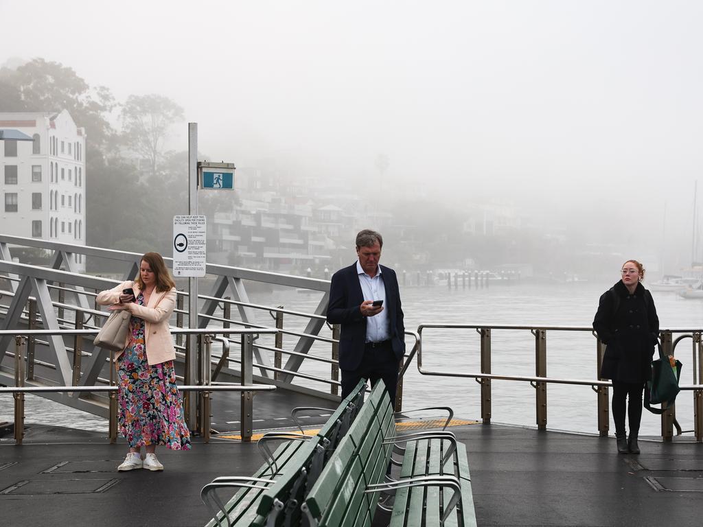 Ferry passengers wait at McMahons Point Monday morning. Photo: NewsWire / Gaye Gerard