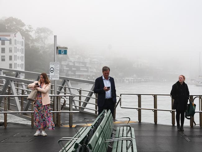 Ferry passengers wait at McMahons Point Monday morning. Photo: NewsWire / Gaye Gerard