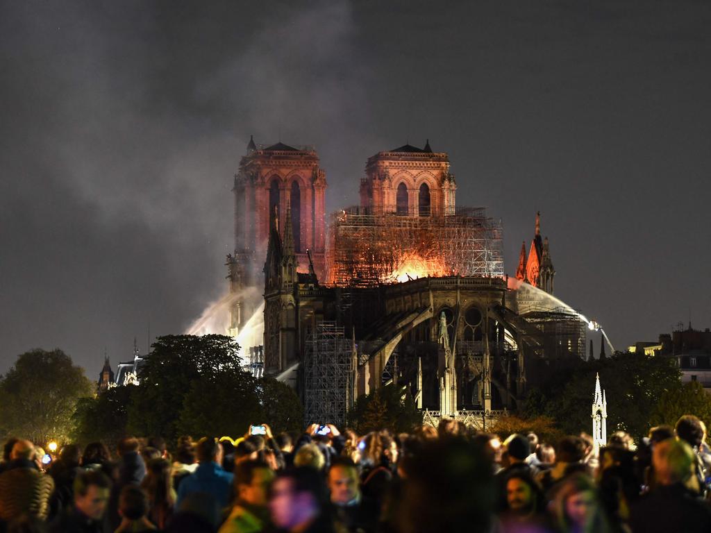 Parisians flocked to watch their beloved cathedral burn. Picture: Eric Feferberg / AFP