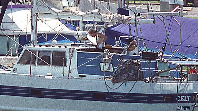 Forensic officers pictured on-board yacht The Celt in Cullen Bay, Darwin in 2001. Picture: Supplied