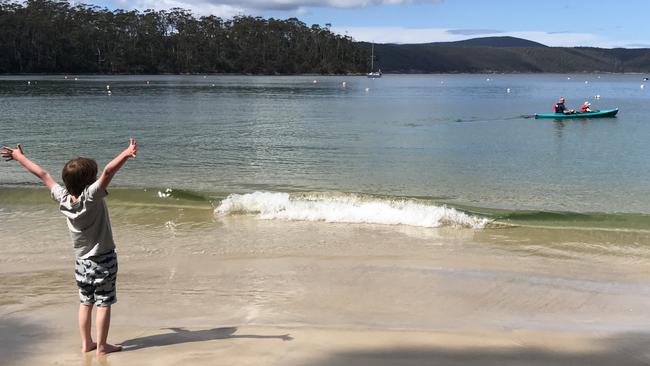 Watching kayakers from the beach at Stewarts Bay. Picture: Linda Smith