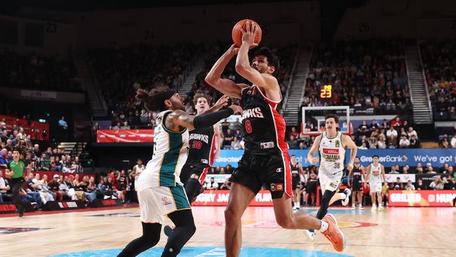 WOLLONGONG, AUSTRALIA – OCTOBER 12: William Hickey of the Hawks drives to the basket under pressure from Jordon Crawford of the JackJumpers during the round four NBL match between Illawarra Hawks and Tasmania JackJumpers at WIN Entertainment Centre on October 12, 2024 in Wollongong, Australia. (Photo by Jason McCawley/Getty Images)