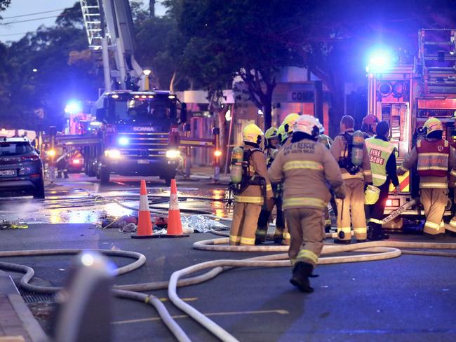 Firefighters at work at the early morning scene at Neutral Bay.