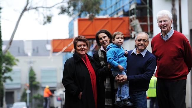 Karen Wiltshire, Carolyn Corrigan, Alfredo Busto Ramirez with James Bustos McNeil, 2, and Tony Bowra are opposed to the development.