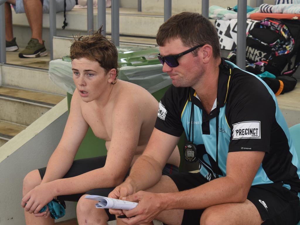 Gladstone South swimmer Dax Andrews with coach Adam Eiseman at the Central Queensland Swimming Championships at the 2nd World War Memorial Aquatic Centre, Rockhampton, on March 1, 2025.