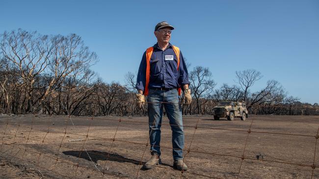 Blaze Aid volunteer Ross Murray working with Army Reservists to replace stock fencing on farmer Josh Graham's property. Picture: Brad Fleet