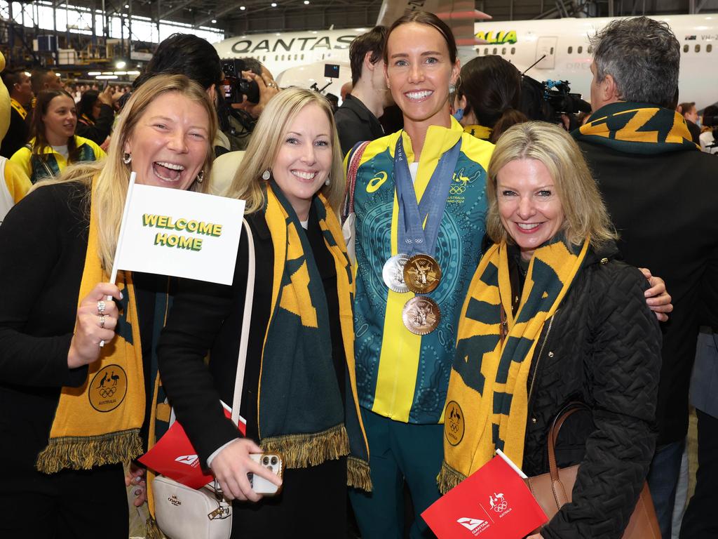 Emma McKeon with her welcoming committee. Picture: Rohan Kelly