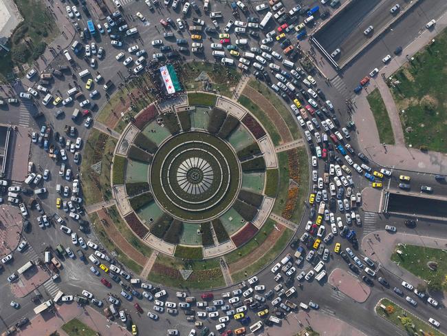 This aerial photo shows people celebrating with a large Syrian opposition flag at Umayyad Square in Damascus. Picture: AFP