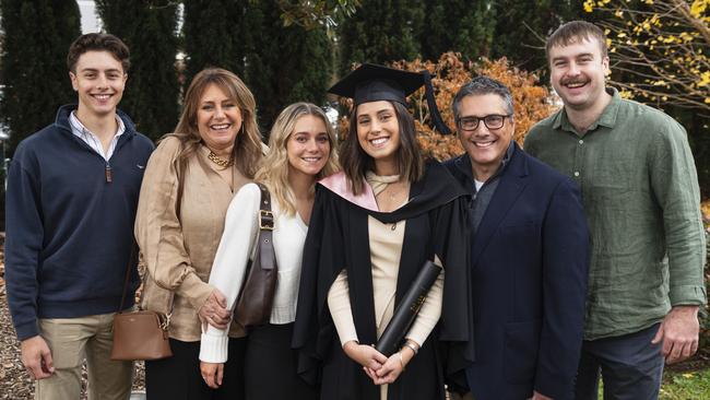 Bachelor of Education (Primary) graduate Christalla Fatseas with (from left) Ted Fatseas, Maria Fatseas, Anastasia Fatseas, Steve Fatseas and Harry Claydon at a UniSQ graduation ceremony at The Empire, Tuesday, June 25, 2024. Picture: Kevin Farmer